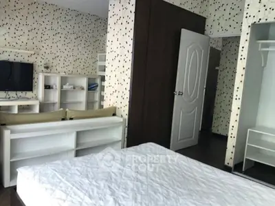 Cozy bedroom with modern decor and ample storage space