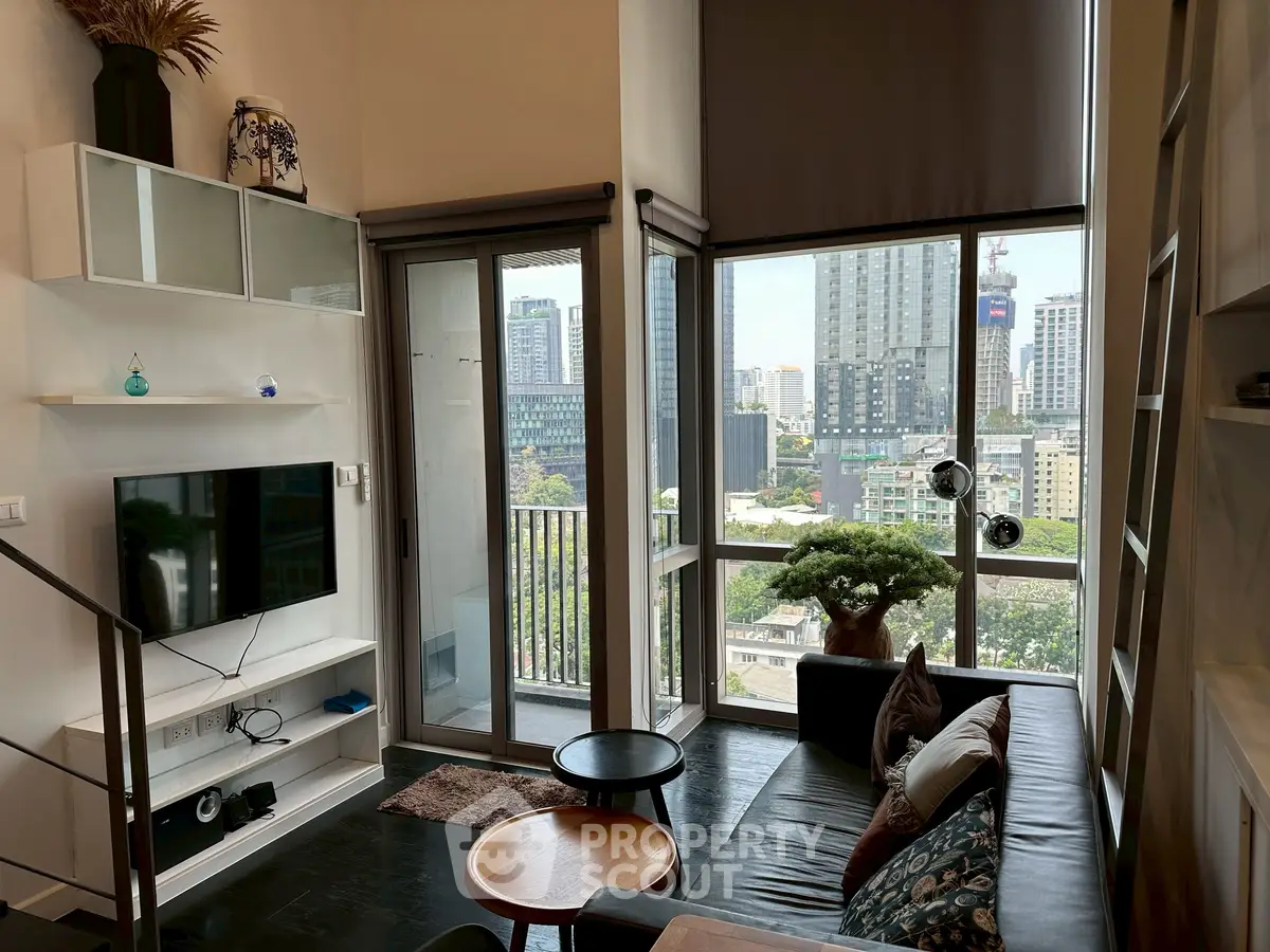 Modern living room with city view, stylish decor, and natural light.