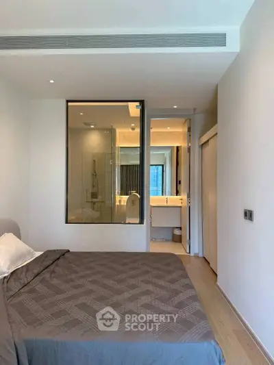 Modern bedroom with ensuite bathroom and stylish decor