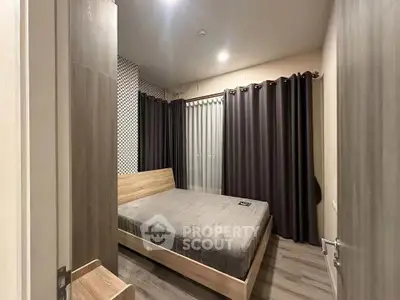 Modern bedroom with sleek design and cozy ambiance, featuring a comfortable bed and stylish decor.