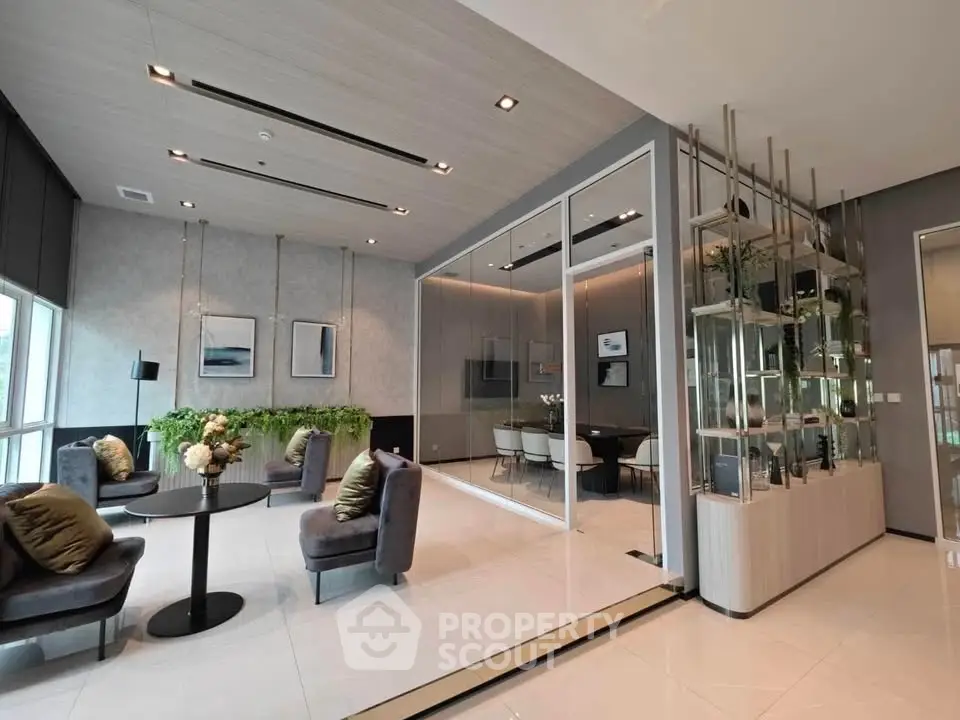 Modern living room with elegant decor and glass partition in luxury apartment.