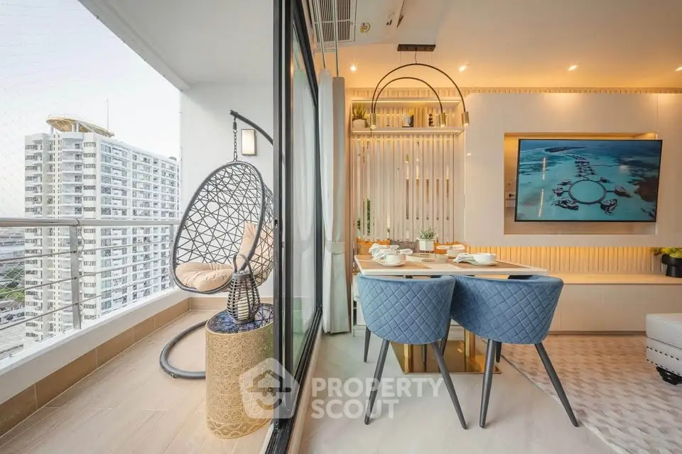 Modern dining area with elegant decor and adjacent balcony offering city views.