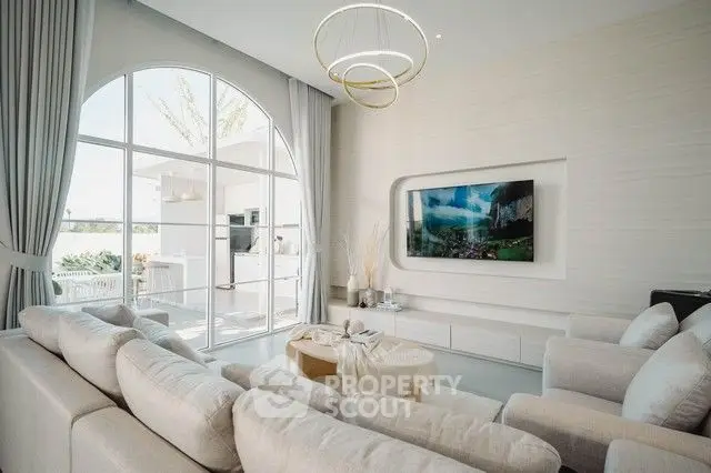 Luxurious modern living room with elegant decor and large window view