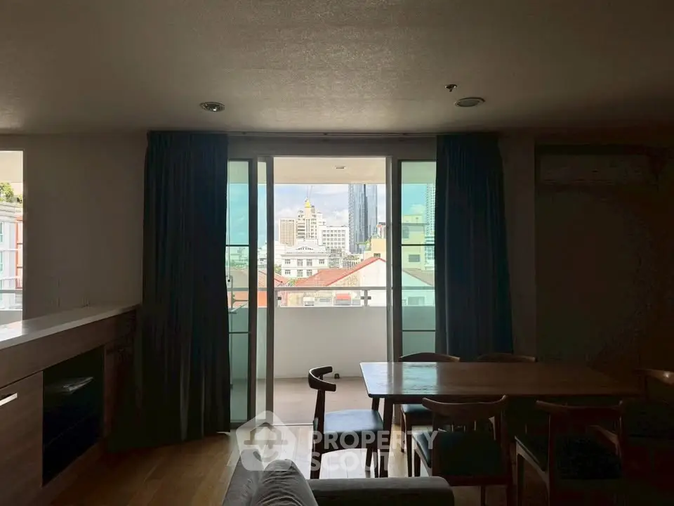 Spacious living room with city view balcony in modern apartment