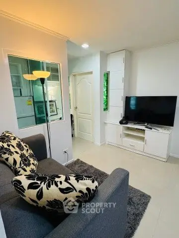 Cozy living room with modern decor and entertainment setup