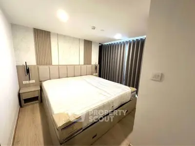 Modern bedroom with stylish decor and ample natural light