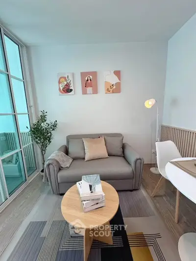 Modern living room with stylish decor and cozy seating area, perfect for relaxation and entertaining.