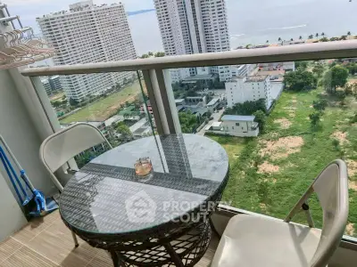 Stunning high-rise balcony with ocean view, perfect for relaxation and enjoying the scenery.