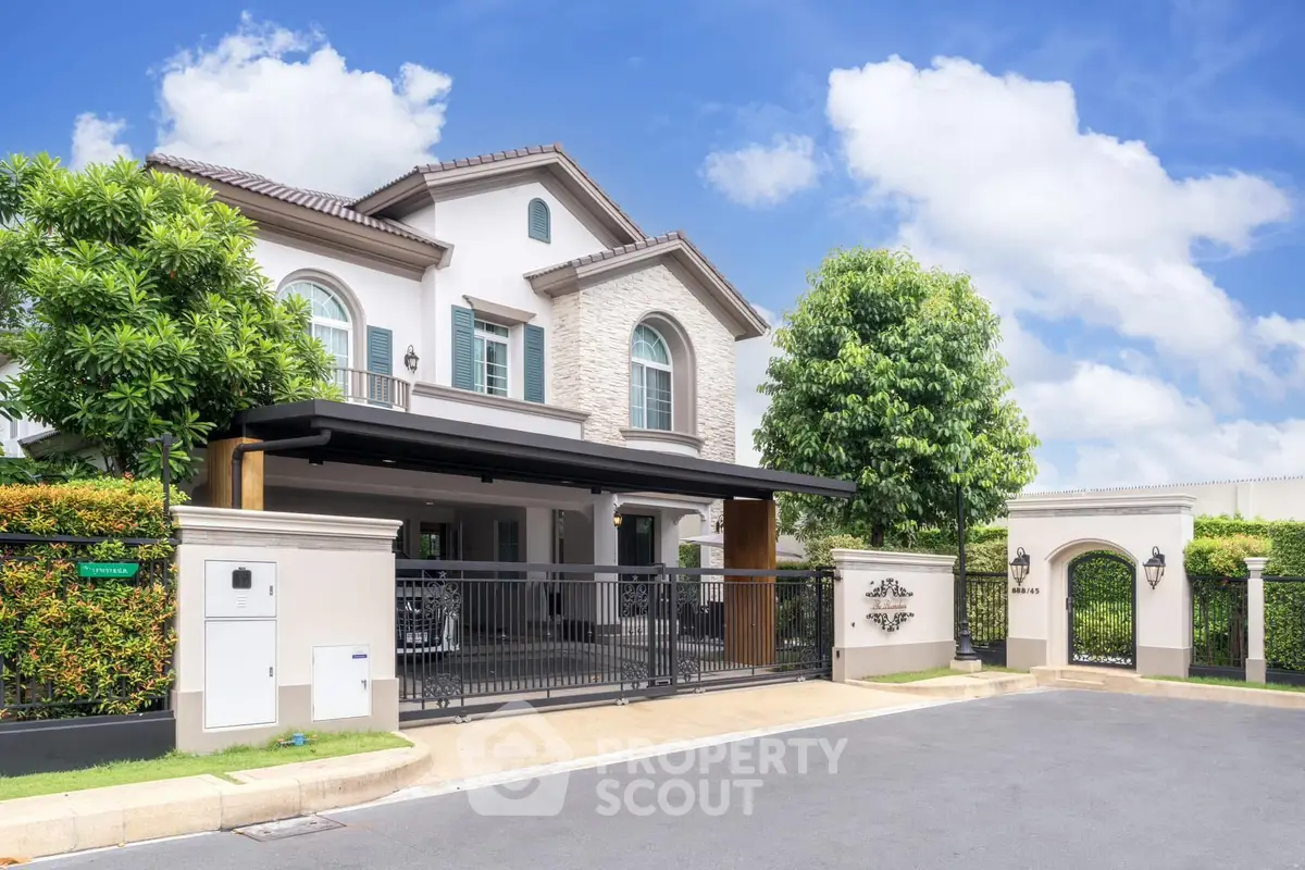 Luxurious modern villa with lush greenery and elegant entrance in a serene neighborhood.