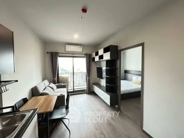 Modern apartment living room with balcony and bedroom view