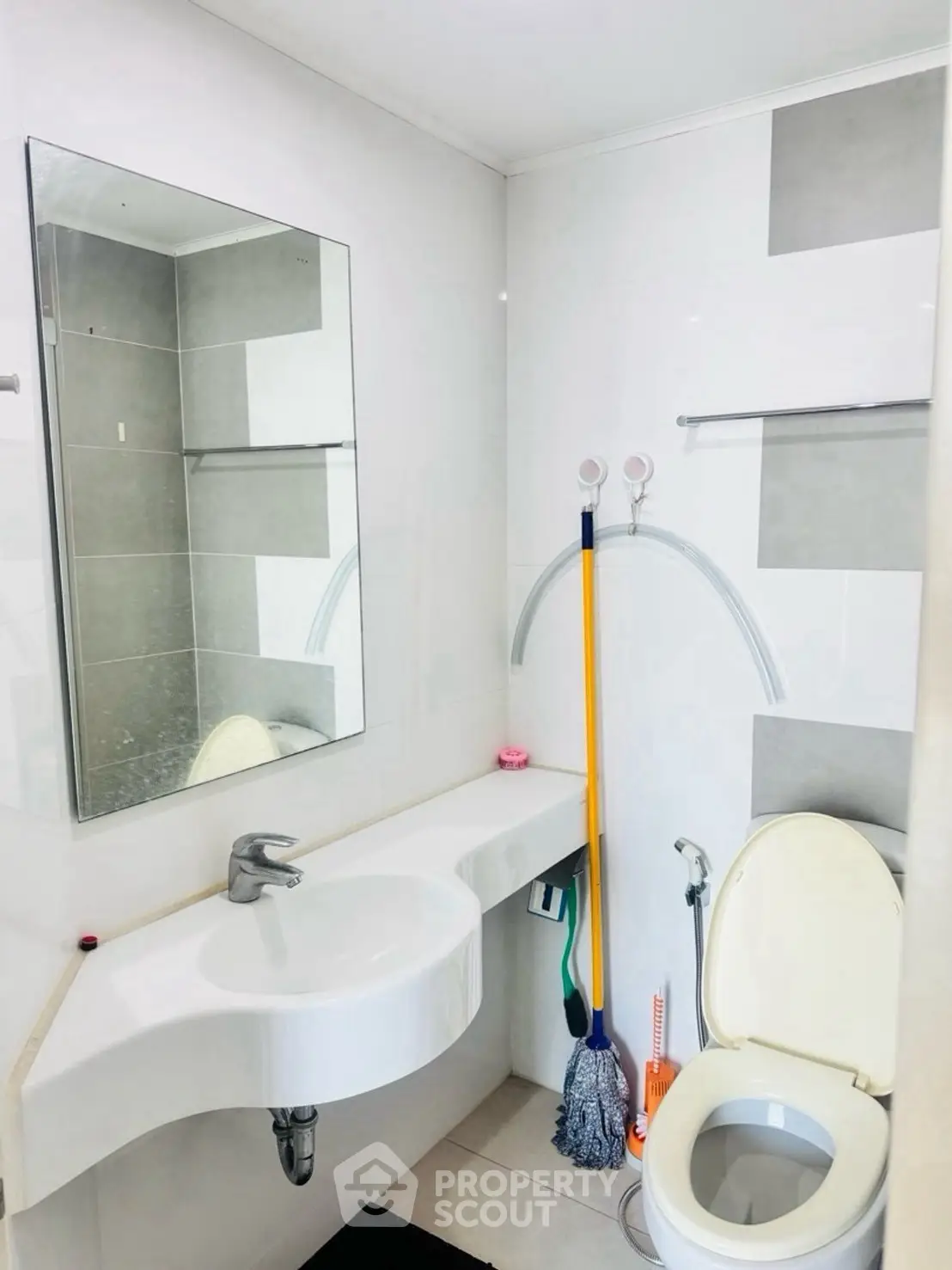 Modern bathroom with sleek fixtures and wall-mounted sink