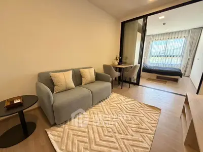 Modern studio apartment with cozy living area and stylish bedroom