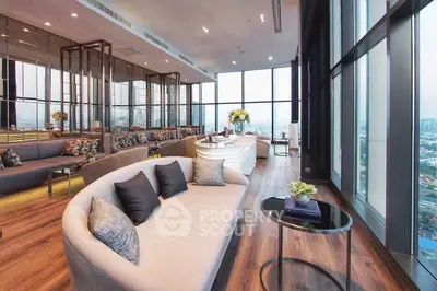 Luxurious modern living room with panoramic city views and elegant furnishings.