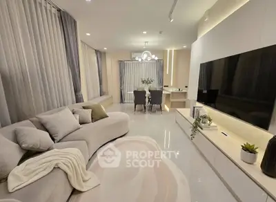 Luxurious modern living room with elegant decor and spacious layout, perfect for relaxation and entertainment.