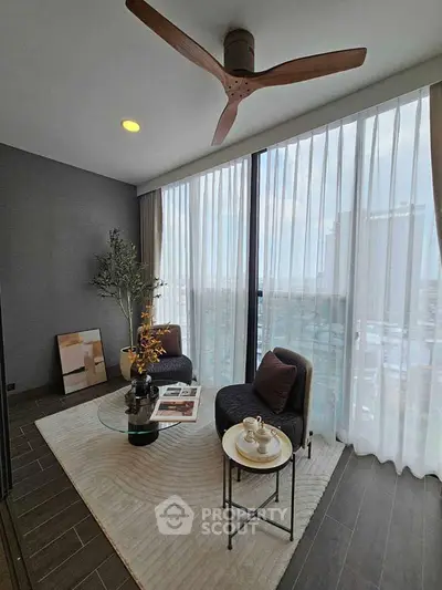 Stylish modern living room with floor-to-ceiling windows and elegant decor