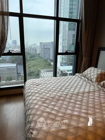 Luxurious bedroom with stunning city view from large window