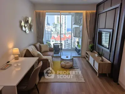 Stylish living room with modern decor and stunning city view from balcony.