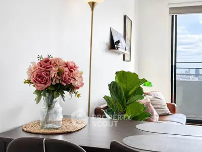 Chic living room with elegant decor and city view, perfect for modern urban living.