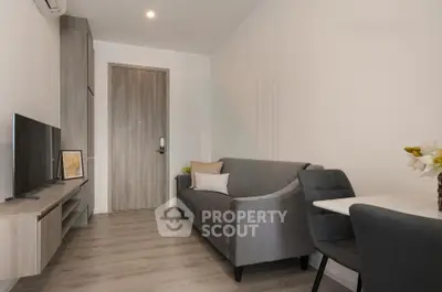 Modern living room with sleek furniture and stylish decor in a cozy apartment.