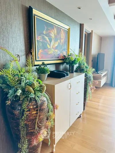 Elegant living room with stylish decor and vibrant plants enhancing the ambiance.