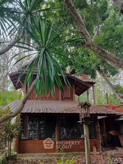 Charming rustic wooden house surrounded by lush greenery, perfect for nature lovers seeking tranquility.