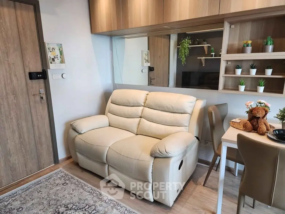 Cozy living room with plush sofa and modern decor in a stylish apartment.