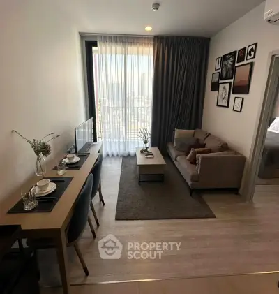 Modern living room with stylish decor and natural light in a cozy apartment.