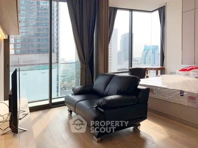 Modern living room with floor-to-ceiling windows and city view