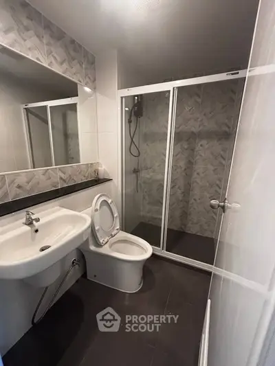 Modern bathroom with sleek shower and elegant tile design