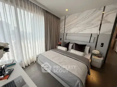 Luxurious modern bedroom with elegant decor and large window view