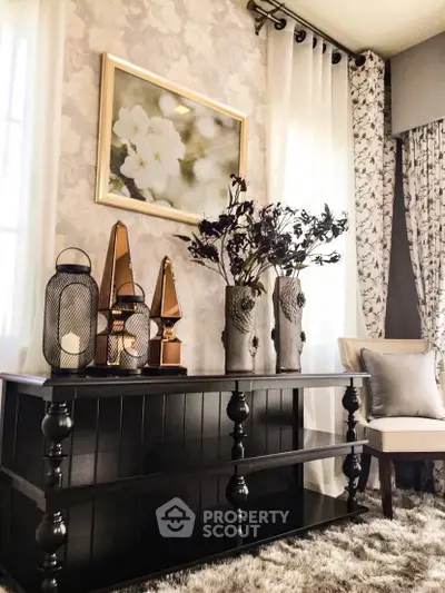 Elegant living room with stylish decor and floral accents, perfect for modern homebuyers.