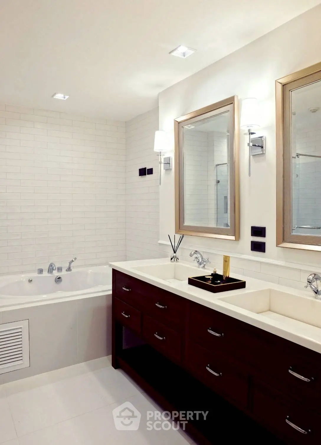 Luxurious bathroom with dual sinks and elegant bathtub in modern home.