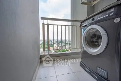 High-rise balcony with washing machine and stunning city view.