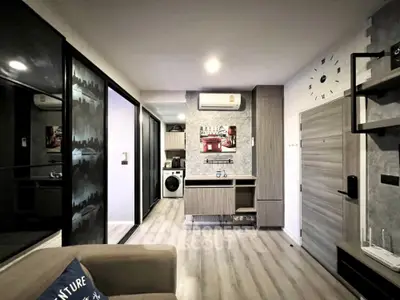 Modern living room with stylish decor and in-unit washing machine