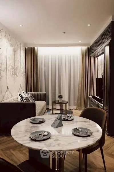 Elegant living room with marble accents and cozy dining area in modern apartment.