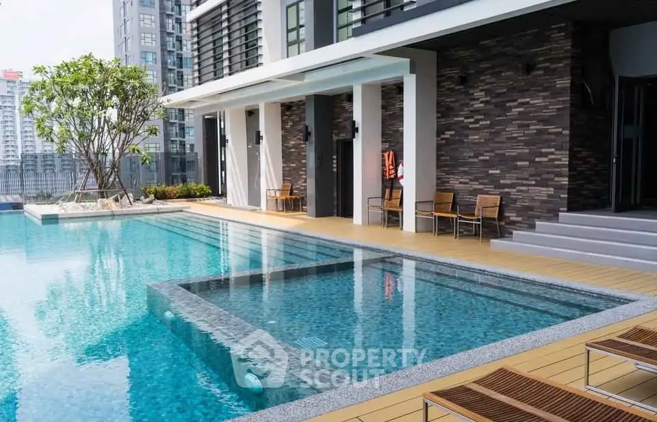 Luxurious rooftop pool with modern design and city skyline view, perfect for relaxation and leisure.