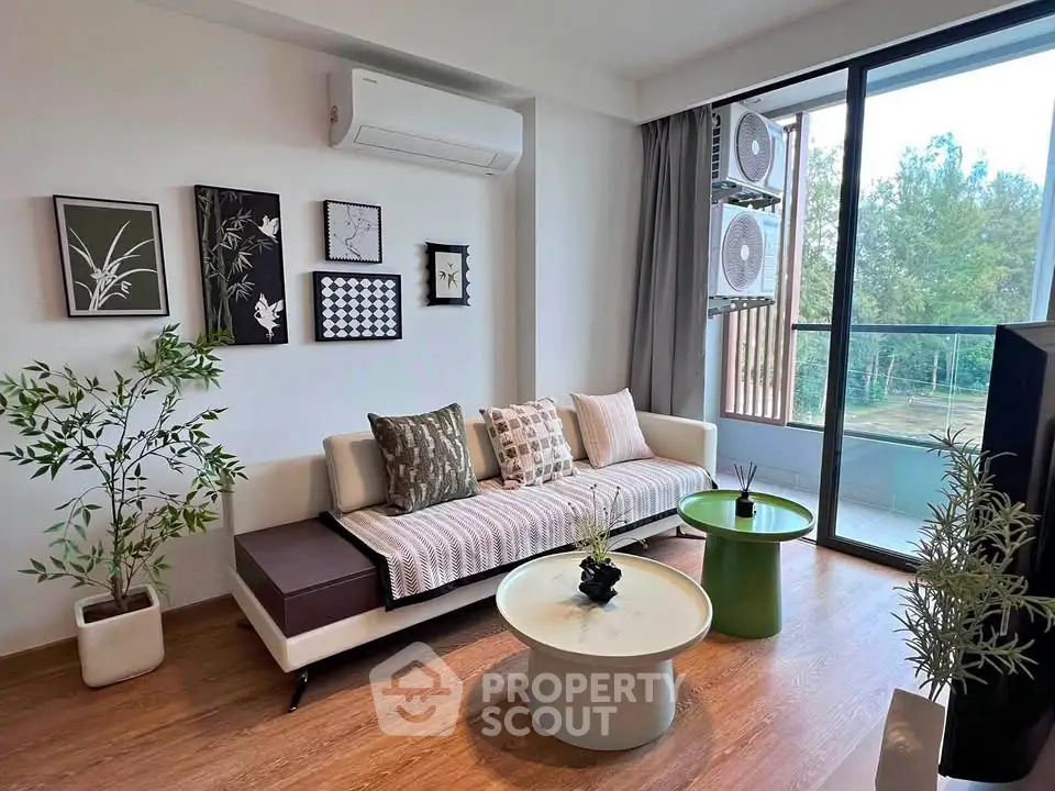 Modern living room with stylish decor and balcony view