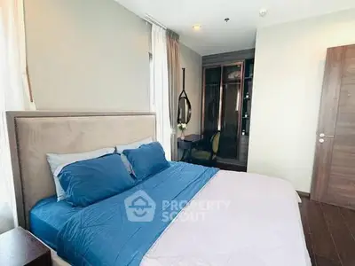 Modern bedroom with stylish decor and ample natural light