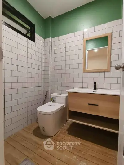 Modern bathroom with sleek design and wooden flooring