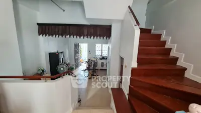 Spacious interior with wooden staircase and open layout, ideal for modern living.