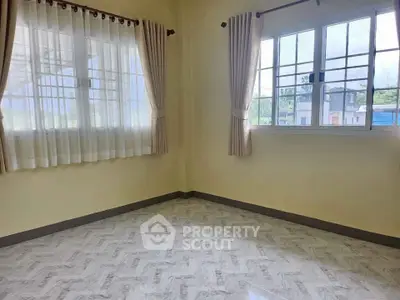 Bright empty room with large windows and tiled floor, perfect for customization.