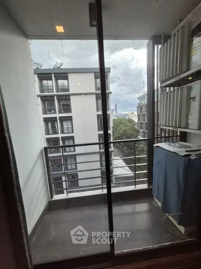 Modern apartment balcony with city view, perfect for urban living.