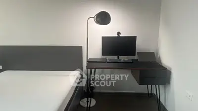 Modern bedroom with sleek workspace and minimalist design