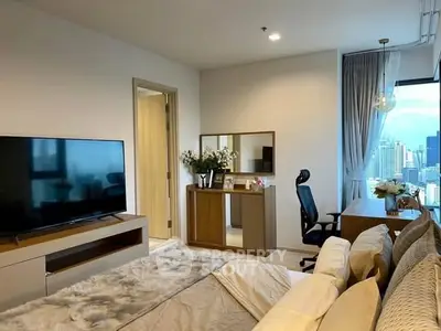 Modern bedroom with city view, stylish decor, and cozy ambiance