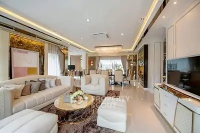 Luxurious open-plan living room with elegant decor and modern furnishings