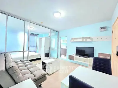 Modern living room with sleek furniture and bright decor in a stylish apartment.