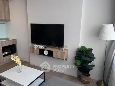 Modern living room with wall-mounted TV and stylish decor