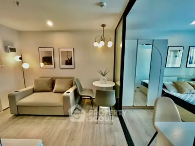 Modern living room with stylish decor and cozy seating in a contemporary apartment.