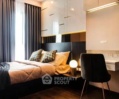 Modern bedroom with stylish decor, cozy bed, and elegant lighting in a contemporary apartment.