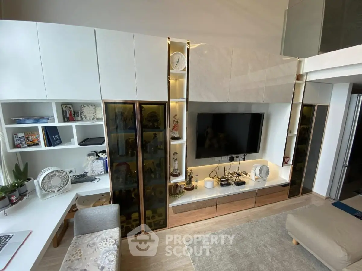 Modern living room with stylish built-in storage and entertainment center